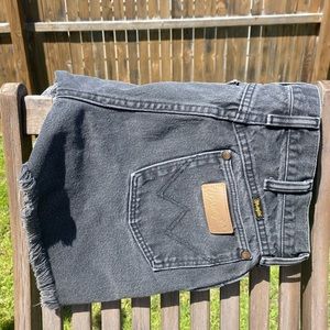 Greyish blackish wrangler cutoffs. High waisted